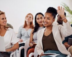 Young woman asking questions with raise hand